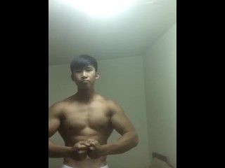 Handsome Taiwanese Bodybuilder Posing Round Uncluttered Boner